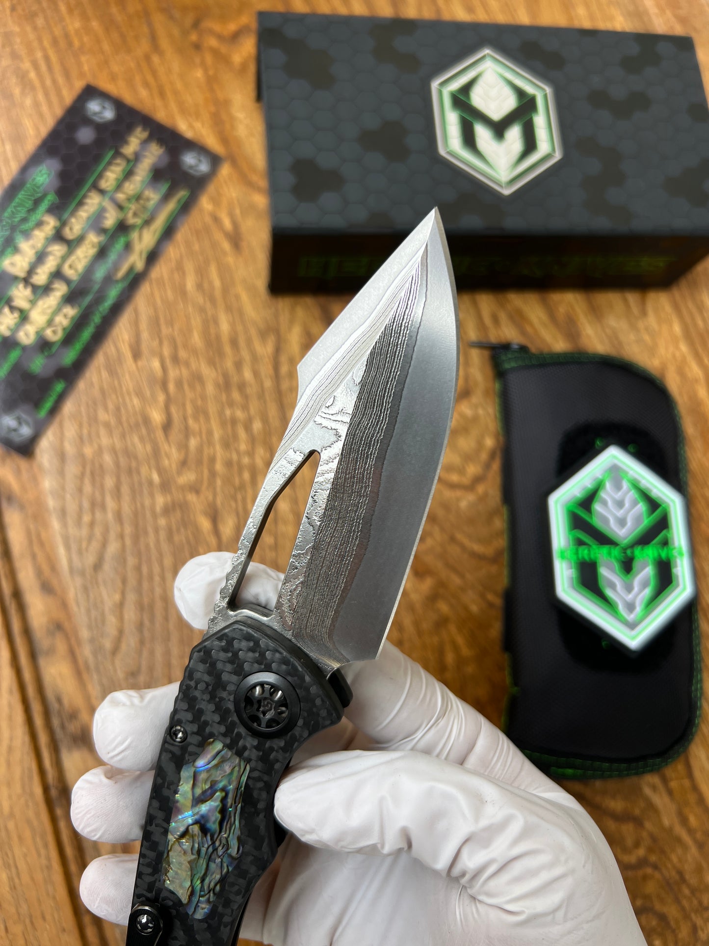 Heretic Knives Pariah Custom M/A Button Lock Carbon Fiber & Abalone Inlay w/ Vegas Forge Wood Grain San Mai Damascus