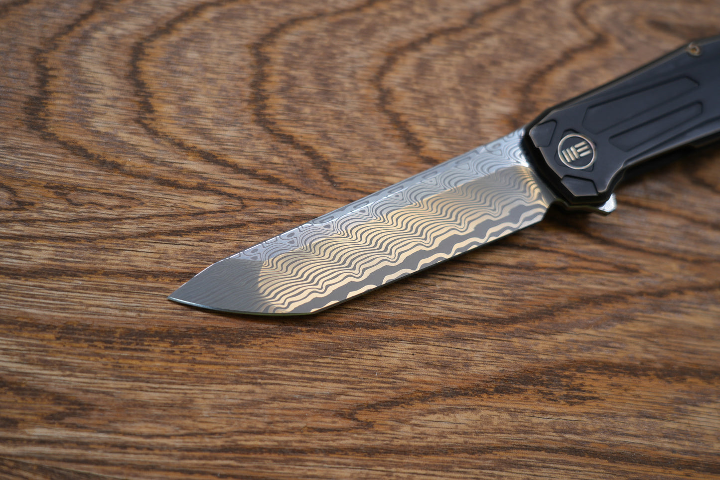 We Knife Company Rafal Brzeski Shadowfire Flipper Knife 3.97" Hakkapella Damasteel Tanto Blade, Bronze/Black Titanium Handles, Frame Lock - WE22035-DS1