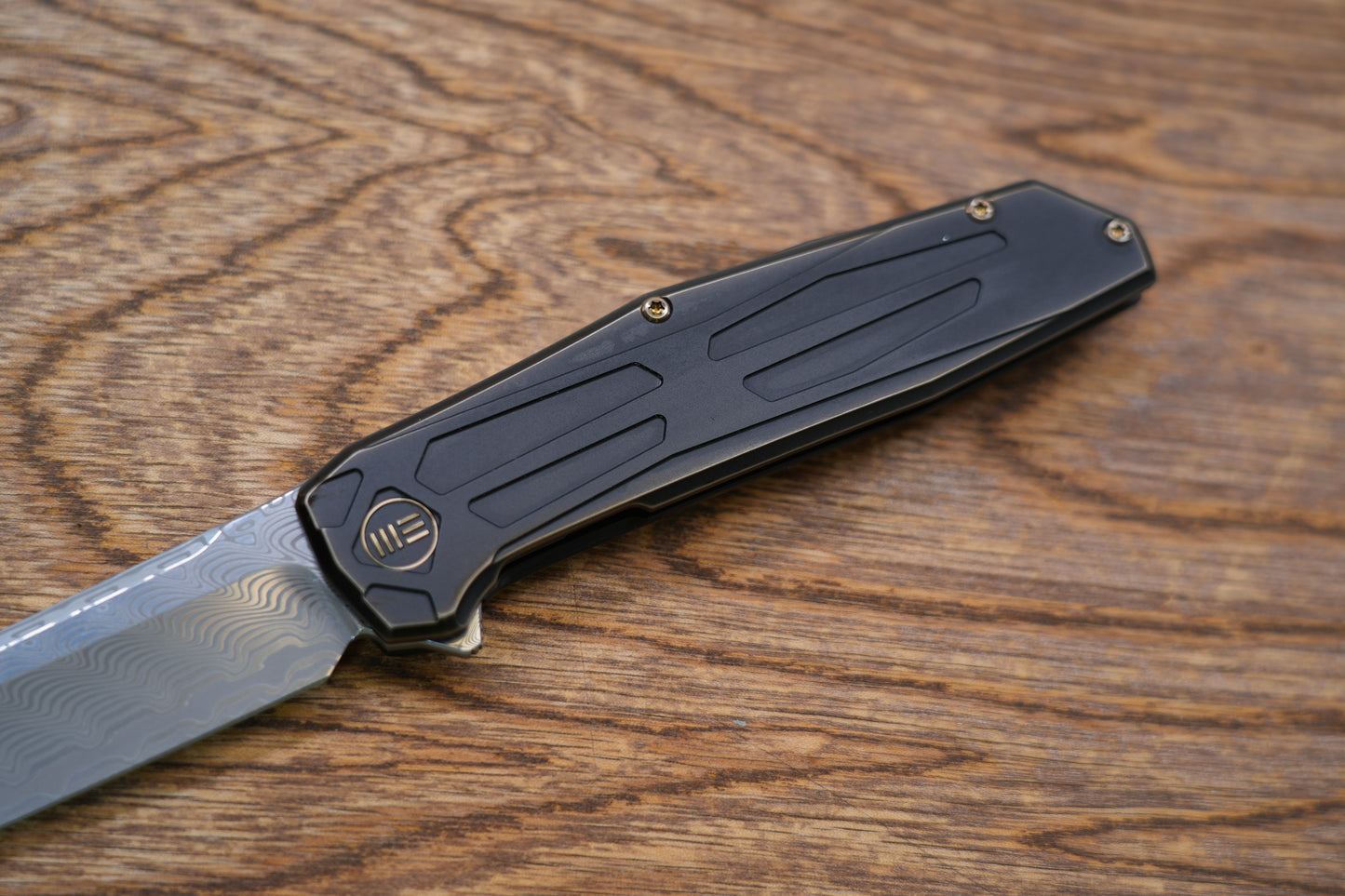 We Knife Company Rafal Brzeski Shadowfire Flipper Knife 3.97" Hakkapella Damasteel Tanto Blade, Bronze/Black Titanium Handles, Frame Lock - WE22035-DS1